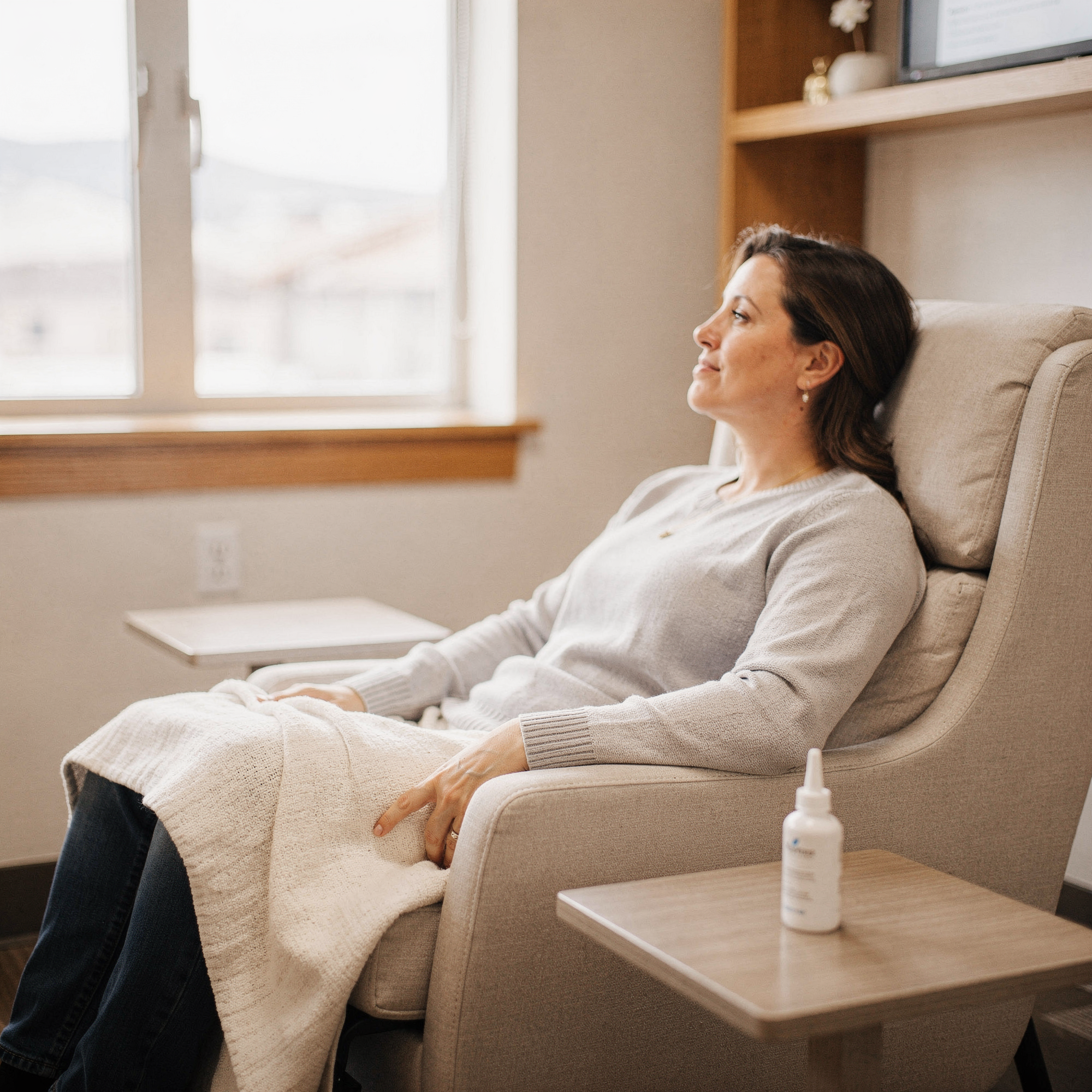 Patient resting in a comfortable chair during Spravato treatment at Myndful Wellness
